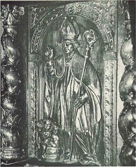Sculptuur afbeelding van Sint Niklaas op de deur van de kansel